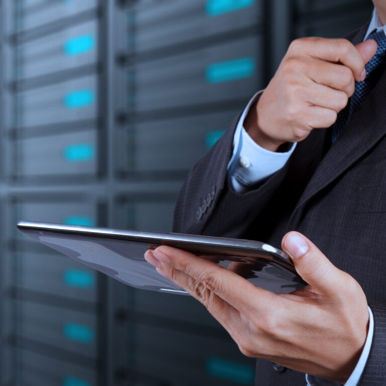 A businessman holding a tablet