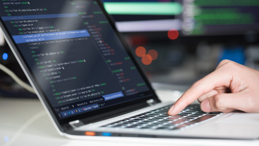 developer working on laptop computer