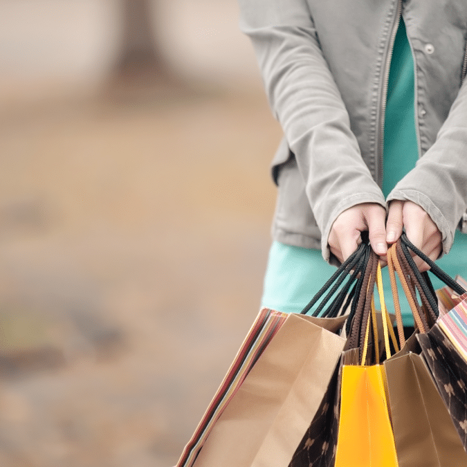 A lady with shopping bags
