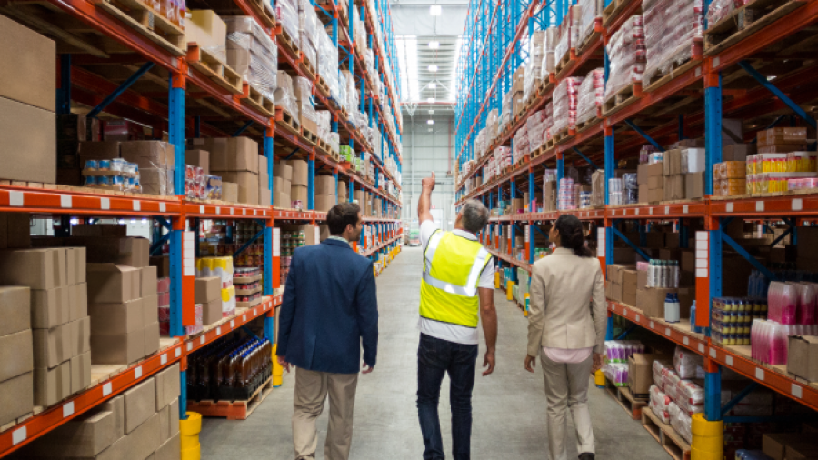 Workers discussing facility real estate design