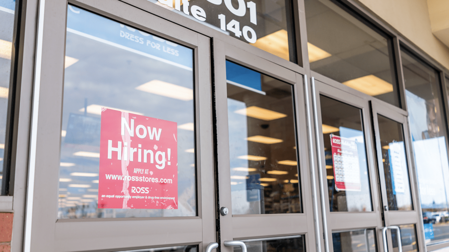 now hiring sign on retail door