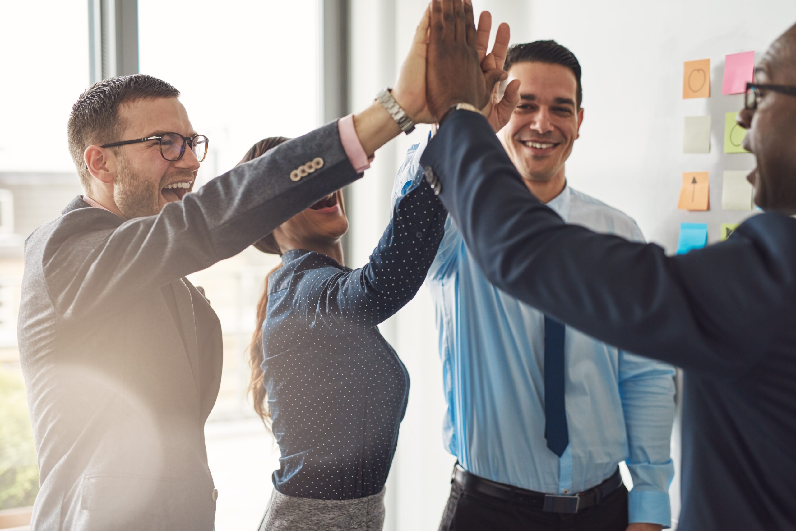 Coworkers high-fiving