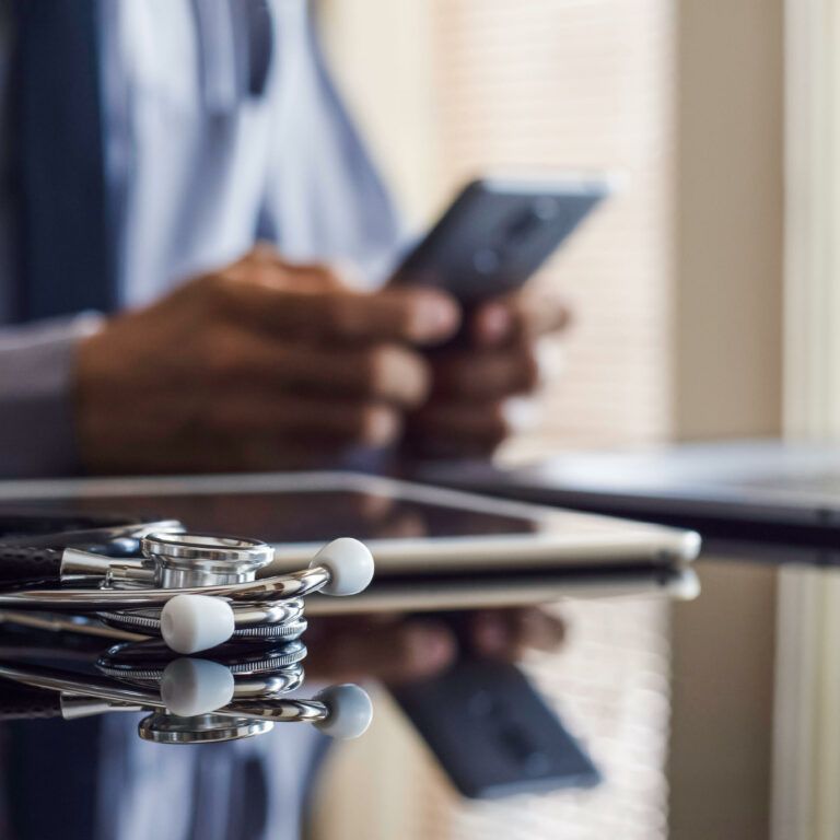 A doctor using telehealth through his phone
