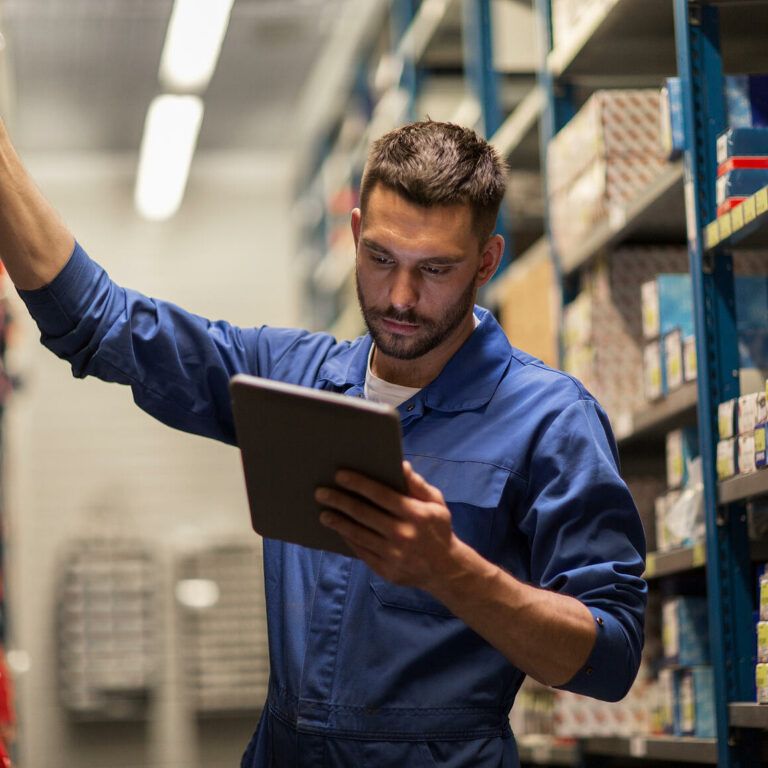 A man checking inventory in a warehouse