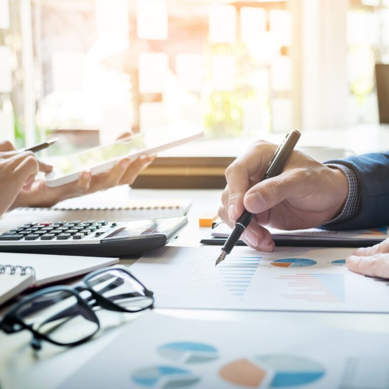 A man and woman filling out a tax reform sheet