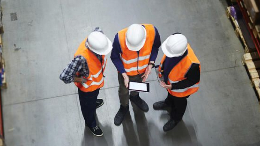 Warehouse workers using a tablet