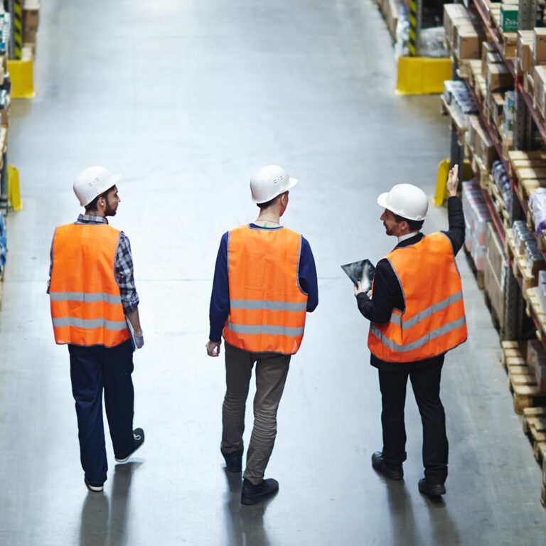 Workers walking in a warehouse