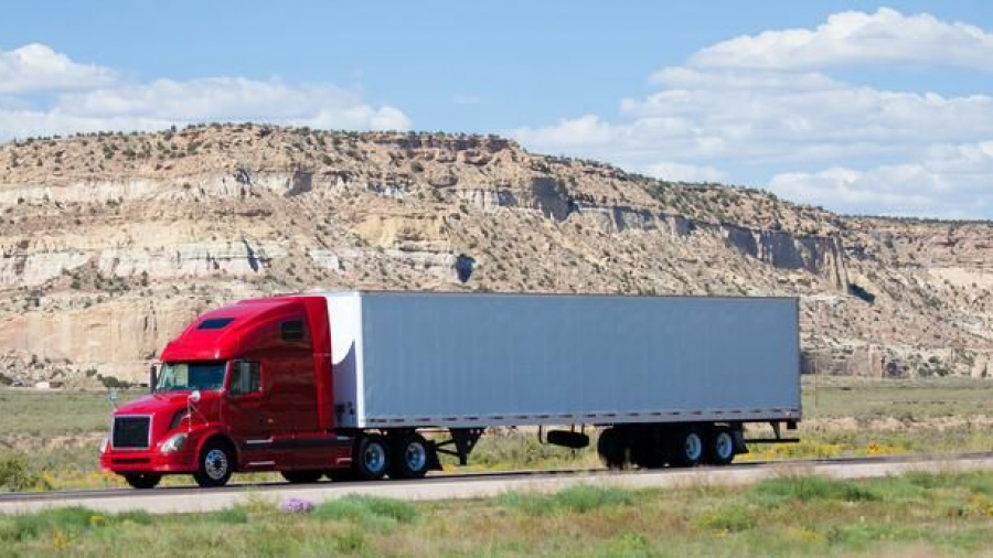 A semi truck driving on a highway