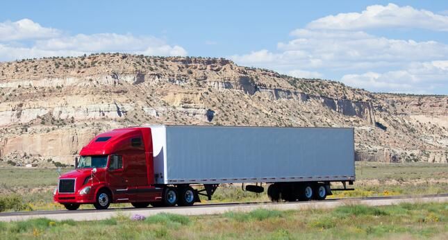 A semi truck driving on a highway