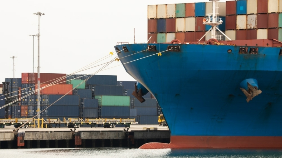 A,Cargo,Vessel,Full,Of,Containers,Sits,Docked,At,Port.