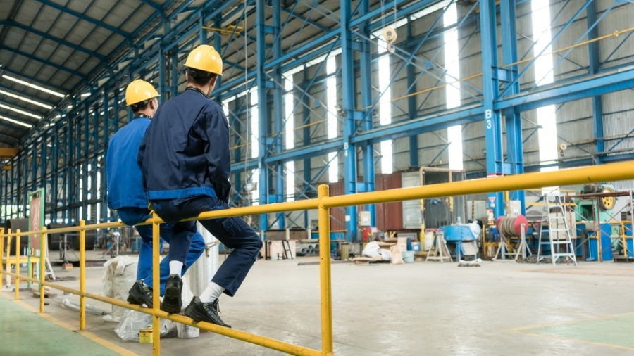 Rear,View,Of,Two,Blue-collar,Workers,During,Break,In,The