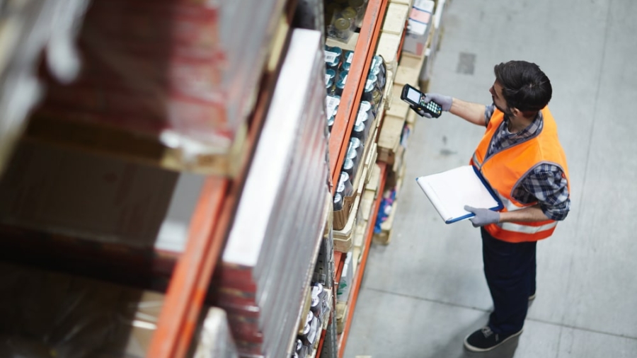 Worker,With,Scanner,Making,Review,Of,Goods,In,Warehouse