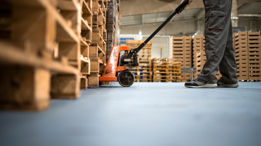 Working,At,Warehouse.,Low,Angle,View,Of,Unrecognizable,Worker,Lifting