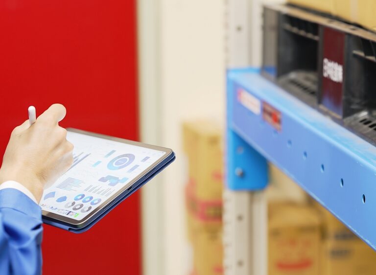 Worker,Checking,Inventory,On,A,Tablet,Warehouse,Management,System.