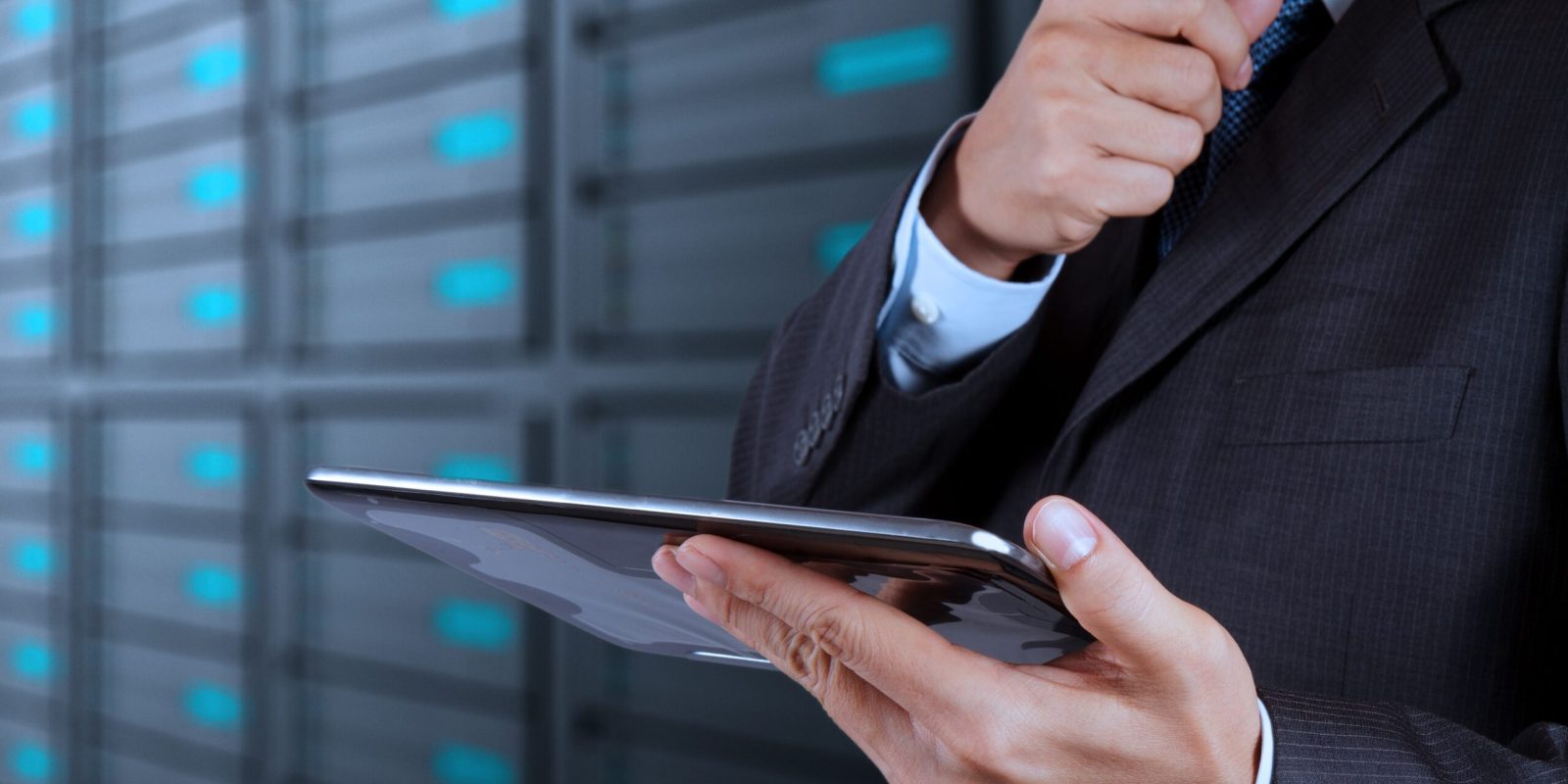 A businessman holding a tablet