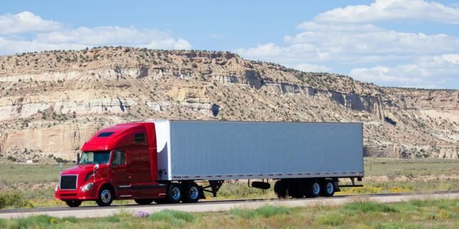 A semi truck driving on a highway