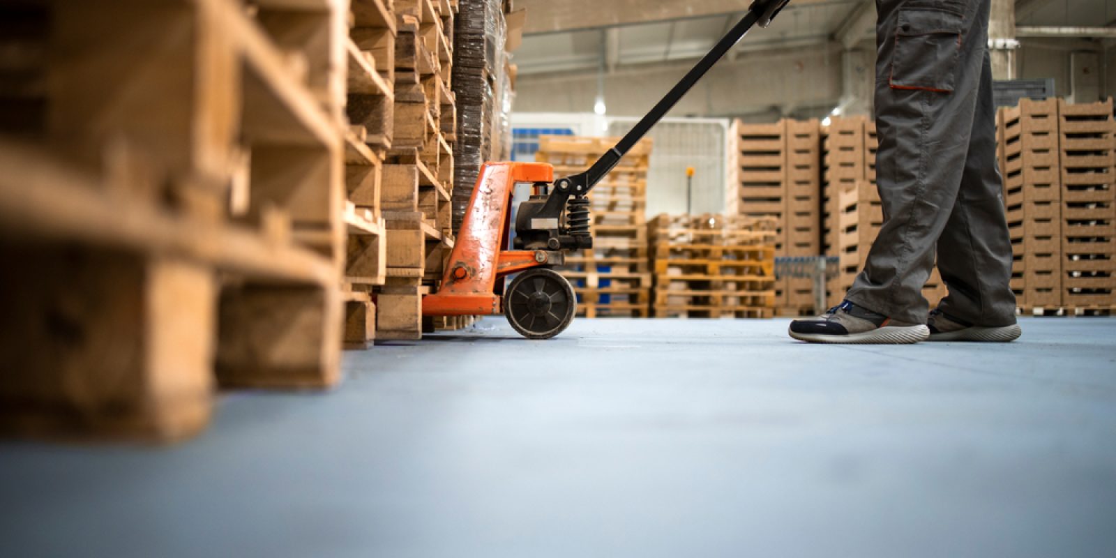 Working,At,Warehouse.,Low,Angle,View,Of,Unrecognizable,Worker,Lifting