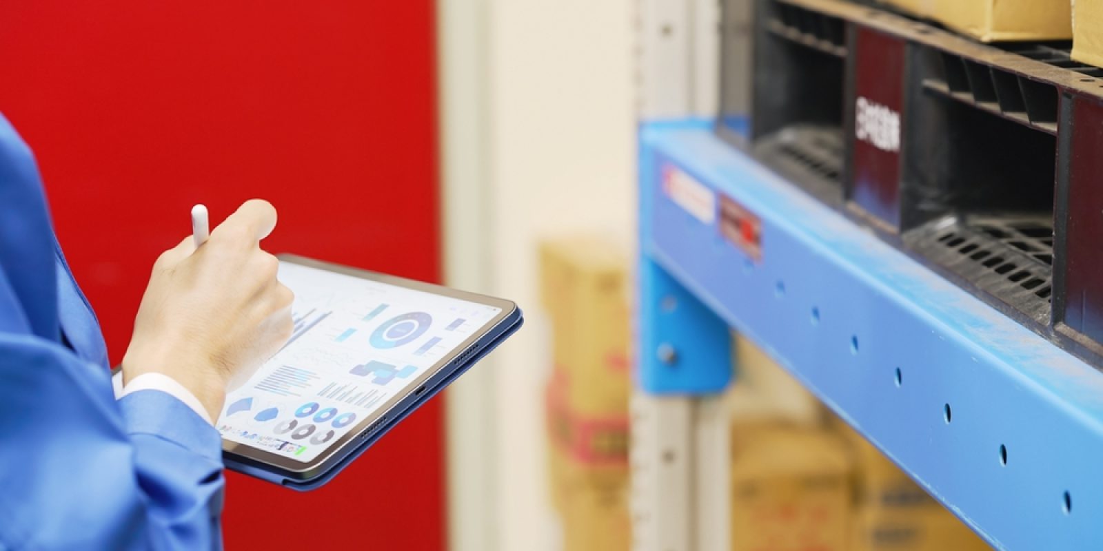 Worker,Checking,Inventory,On,A,Tablet,Warehouse,Management,System.