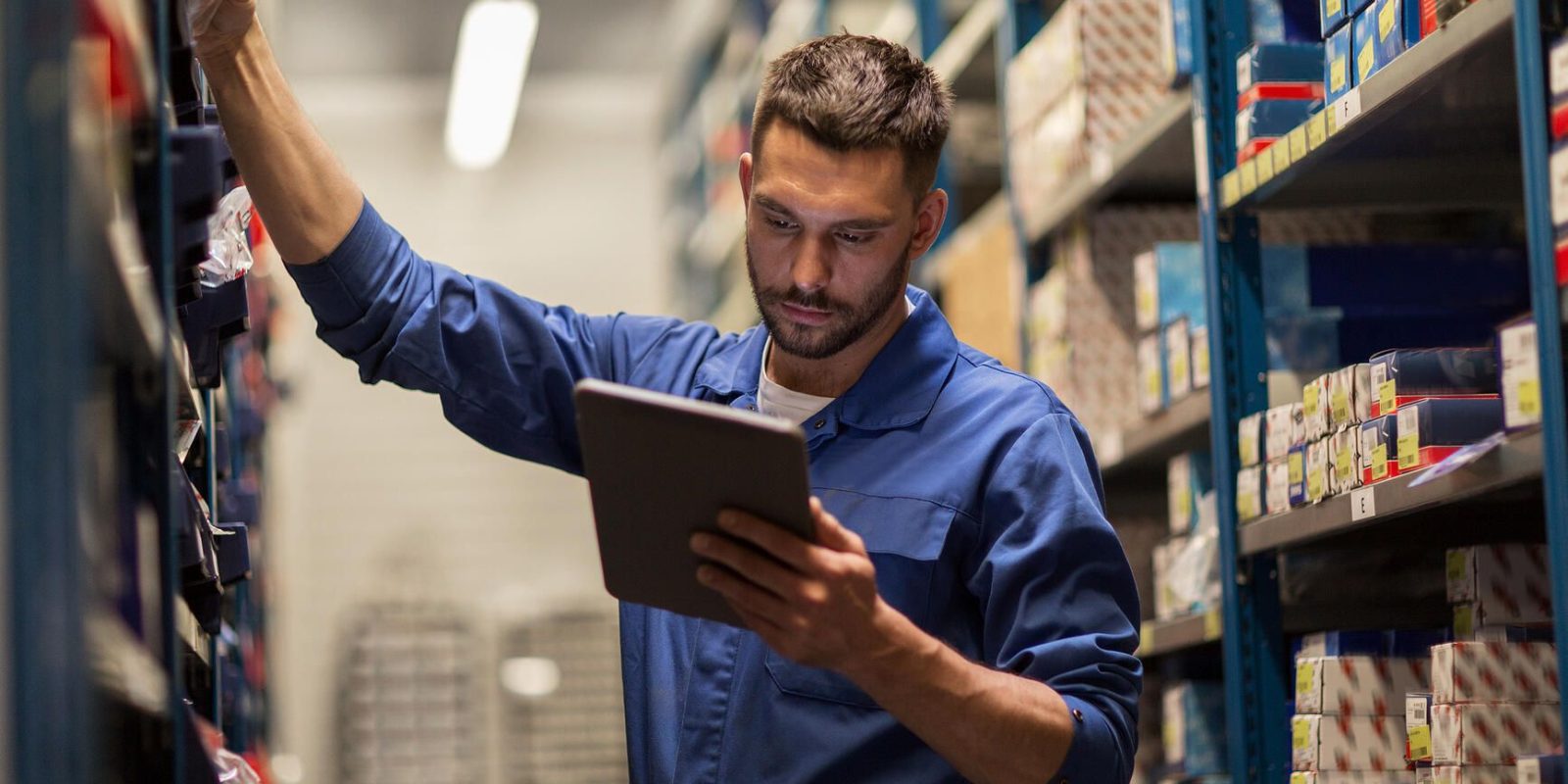 A man checking inventory in a warehouse