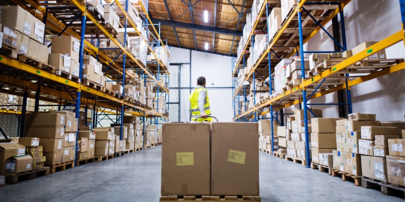 Male,Warehouse,Worker,Pulling,A,Pallet,Truck.