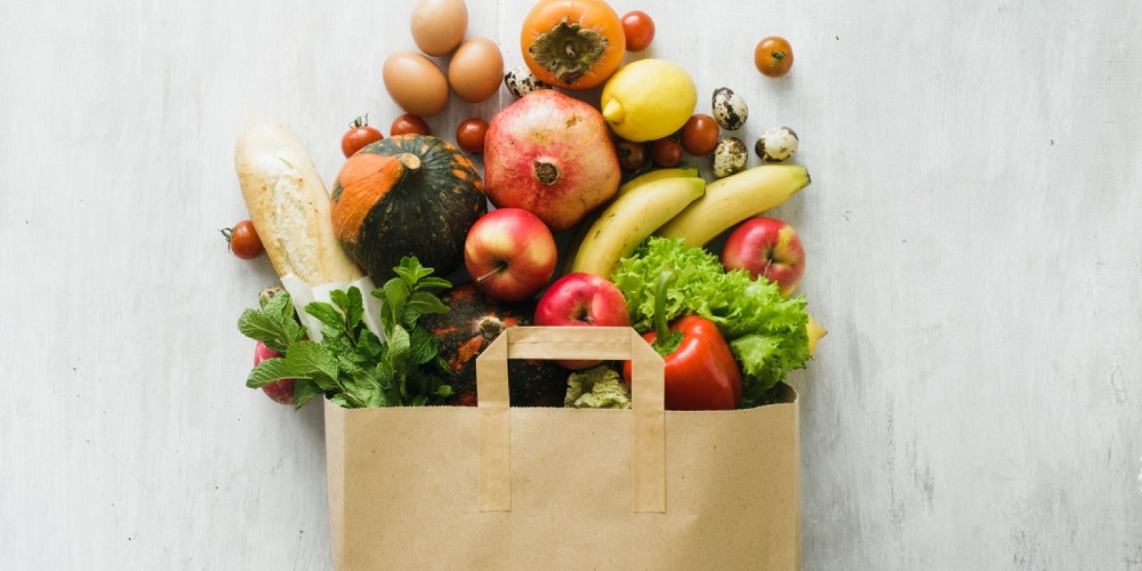 Paper,Bag,Of,Different,Health,Food,On,White,Wooden,Background.