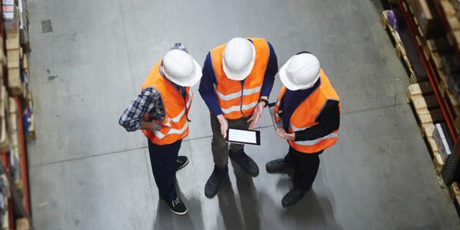 Warehouse workers using a tablet
