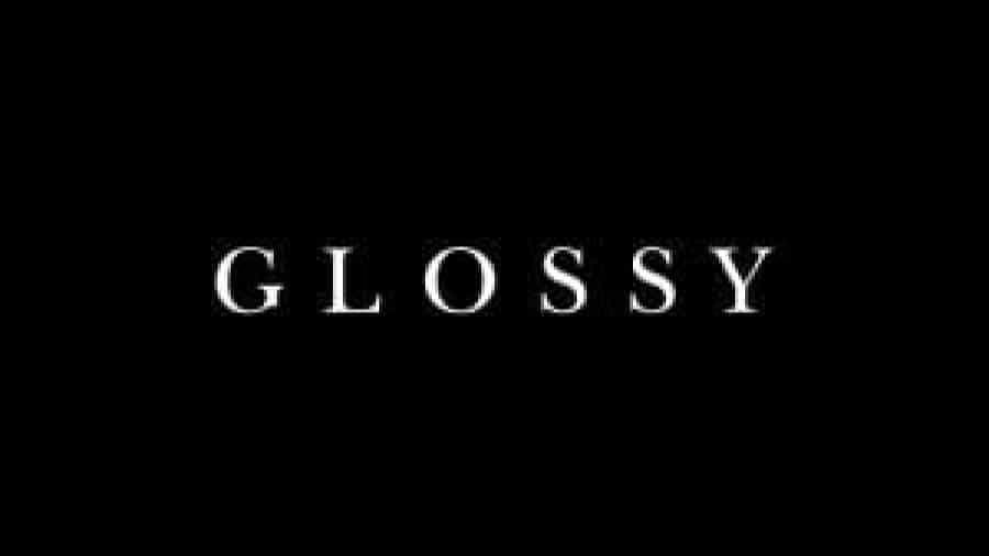 The word GLOSSY is centered in white, uppercase letters on a solid black background.