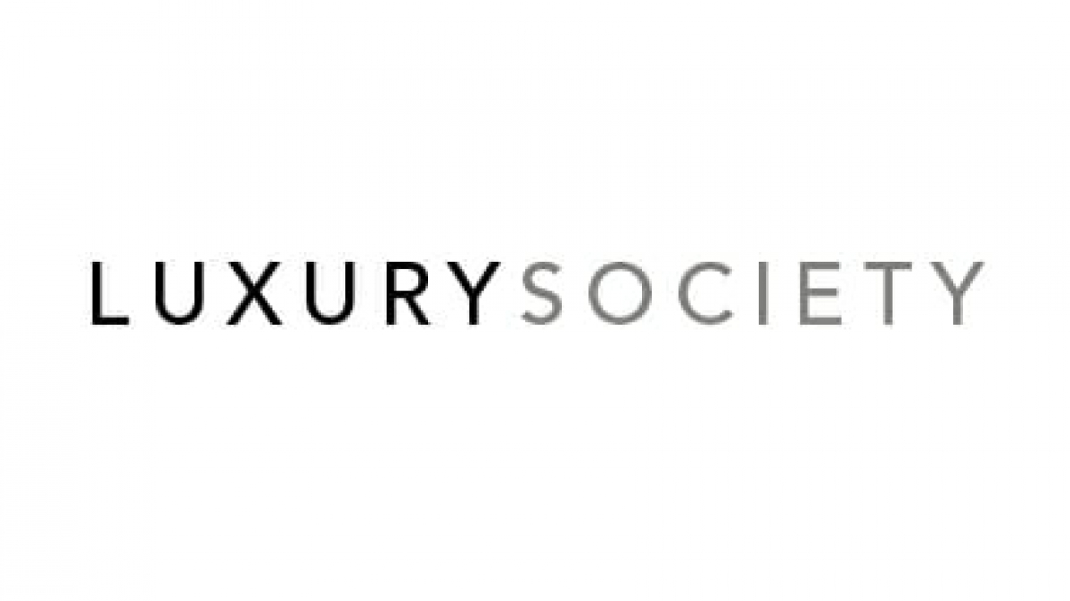 The image features the words LUXURY SOCIETY in a clean, modern font. LUXURY is in bold black letters, while SOCIETY is in light gray letters, all on a white background.