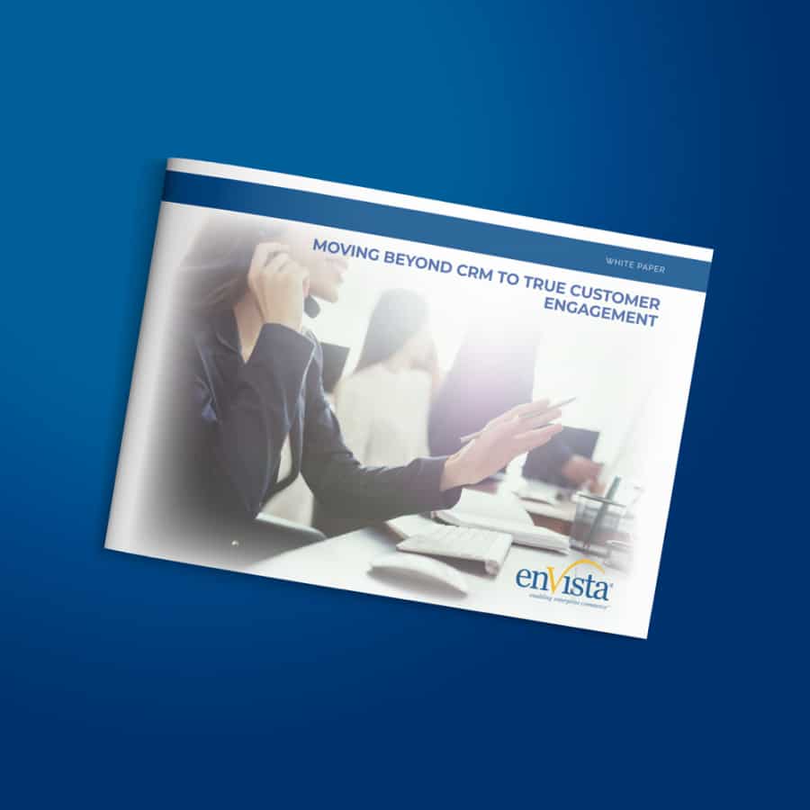A person wearing a headset sits at a desk with a computer, holding a pen. The cover text reads, Moving Beyond CRM to True Customer Engagement. The enVista logo is at the bottom right corner.