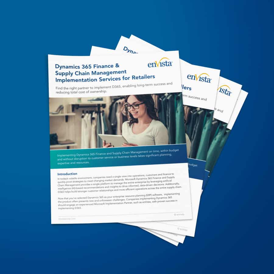 A stack of informational brochures titled Dynamics 365 Finance & Supply Chain Management Implementation Services for Retailers on a blue background, featuring a woman working on a laptop and clothing racks in the background.