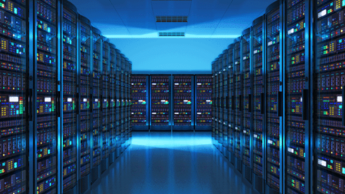 A brightly lit data center with rows of server racks on both sides, filled with colorful blinking lights and a reflective floor, showcases a modern, high-tech atmosphere ideal for cloud managed services.