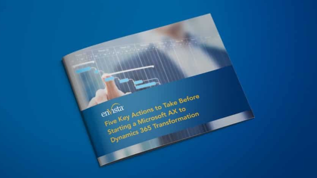 A brochure on a blue surface titled “Five Key Actions to Take Before Starting a Microsoft AX to Dynamics 365 Transformation” with a blurred image of a person pointing at a digital graph.