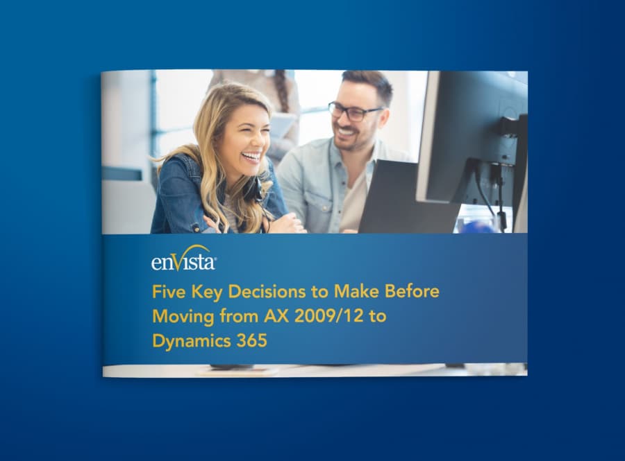 A smiling woman and man sit at a desk with a computer. The text on the image reads: Five Key Decisions to Make Before Moving from AX 2009/12 to Dynamics 365 with the enVista logo above the text.