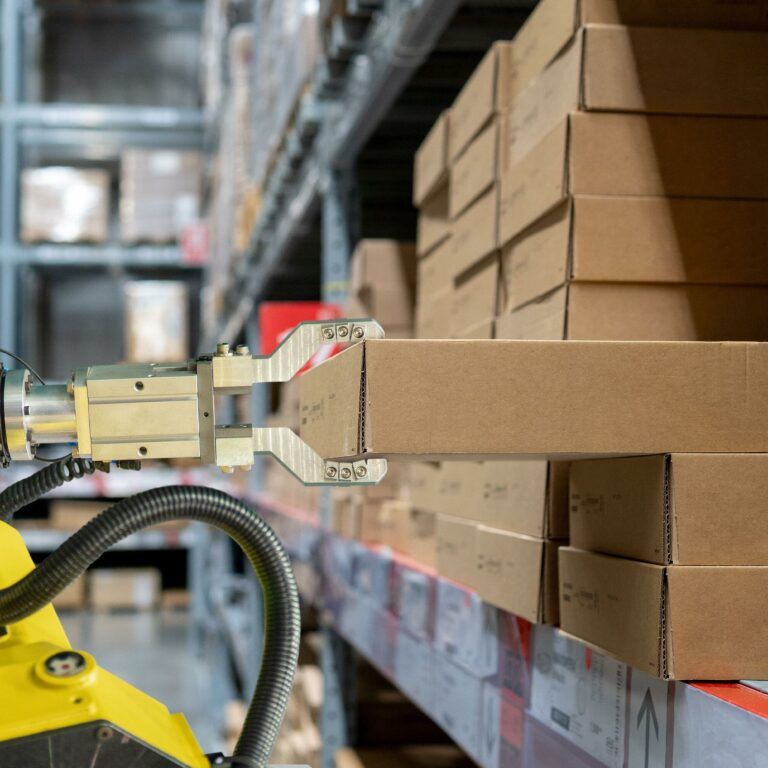 Warehouse robotics moving a package