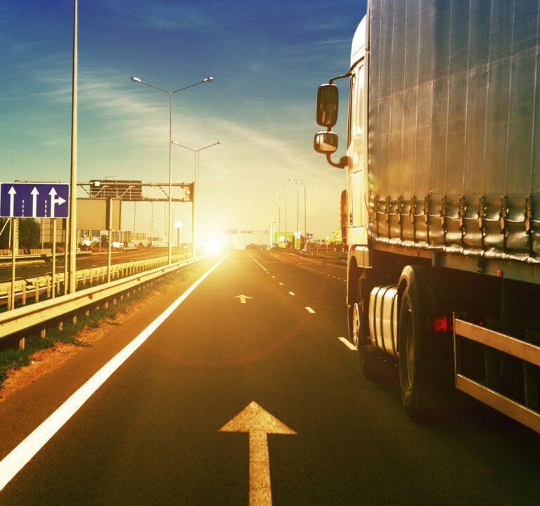 A truck transporting products on the highway