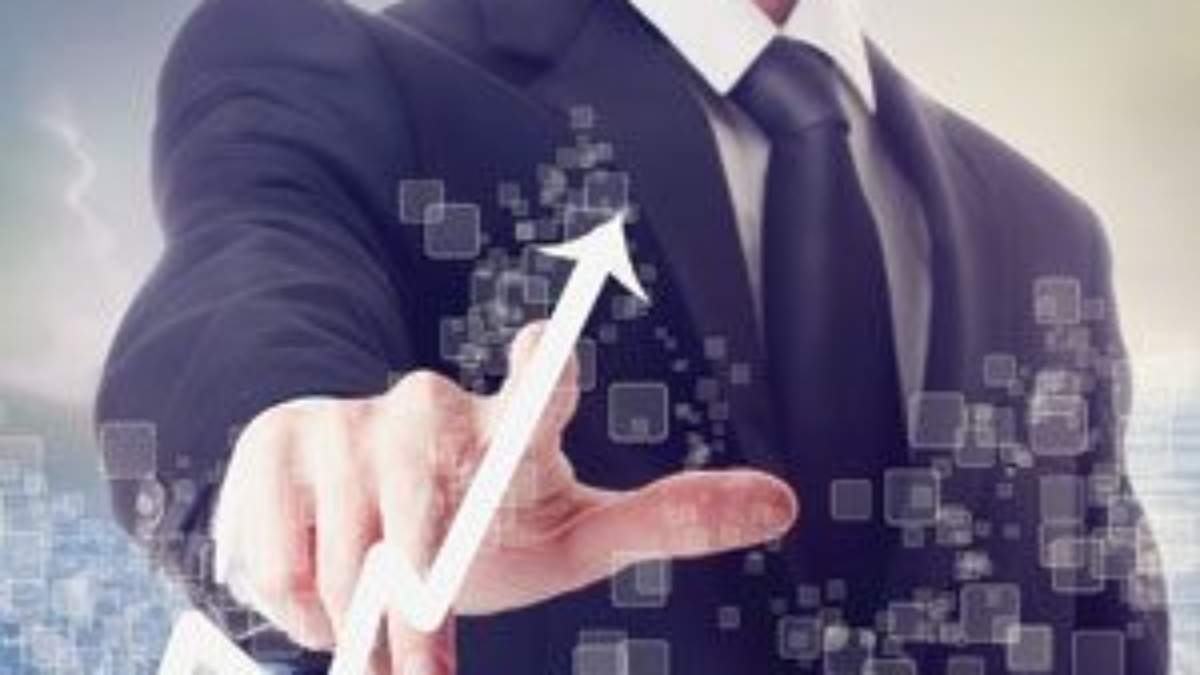 A man in a suit touches a virtual upward-pointing graph, symbolizing business growth or successful supply chain cost management, with digital square icons floating around his hand.