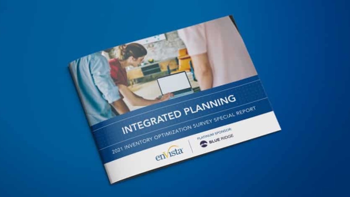A booklet titled Integrated Planning: 2021 Inventory Optimization Survey Special Report lies on a blue surface. The cover features people working on a laptop and logos for en Vista and Blue Ridge.