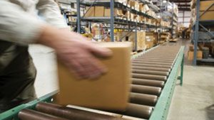 A package being placed on a conveyor belt