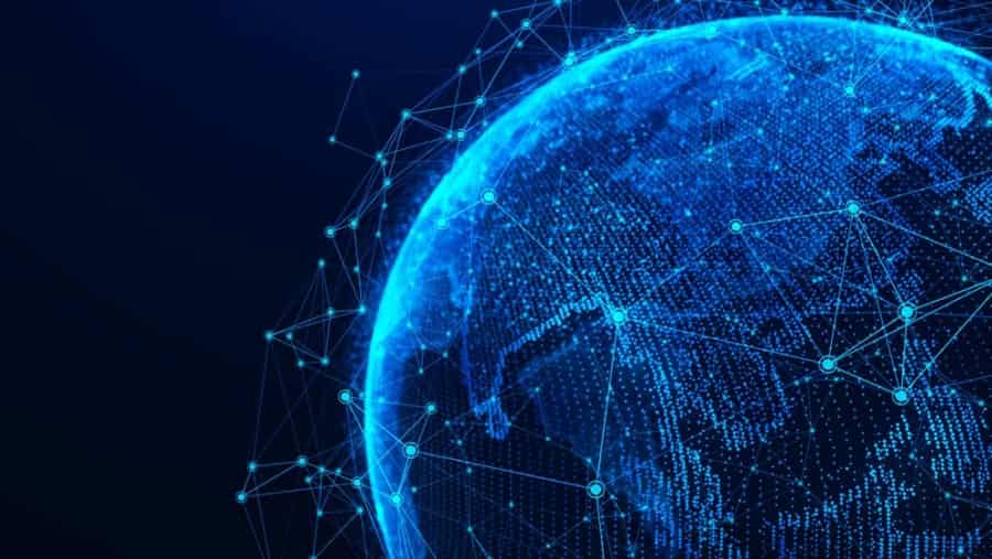 A digital, blue-toned rendering of Earth viewed from space, overlaid with glowing network lines and connection points, symbolizing global connectivity and data exchange.
