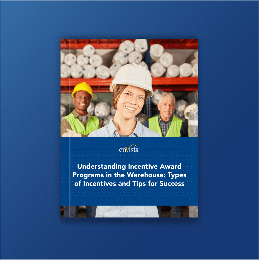 Cover image for a guide titled Understanding Incentive Award Programs in the Warehouse. Features a smiling woman in a hard hat and safety vest, with two warehouse workers and shelves of rolled materials in the background.