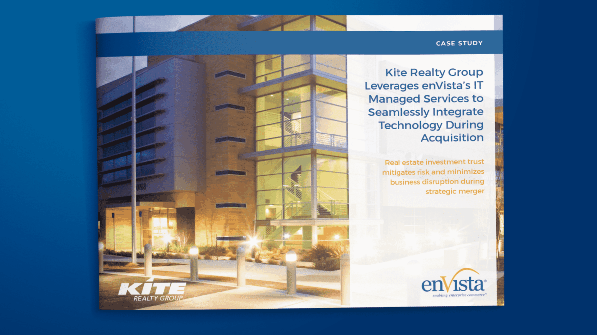 Case study cover showing a modern office building at night with illuminated windows. The text highlights Kite Realty Group utilizing enVistas IT services for integrating technology during an acquisition.