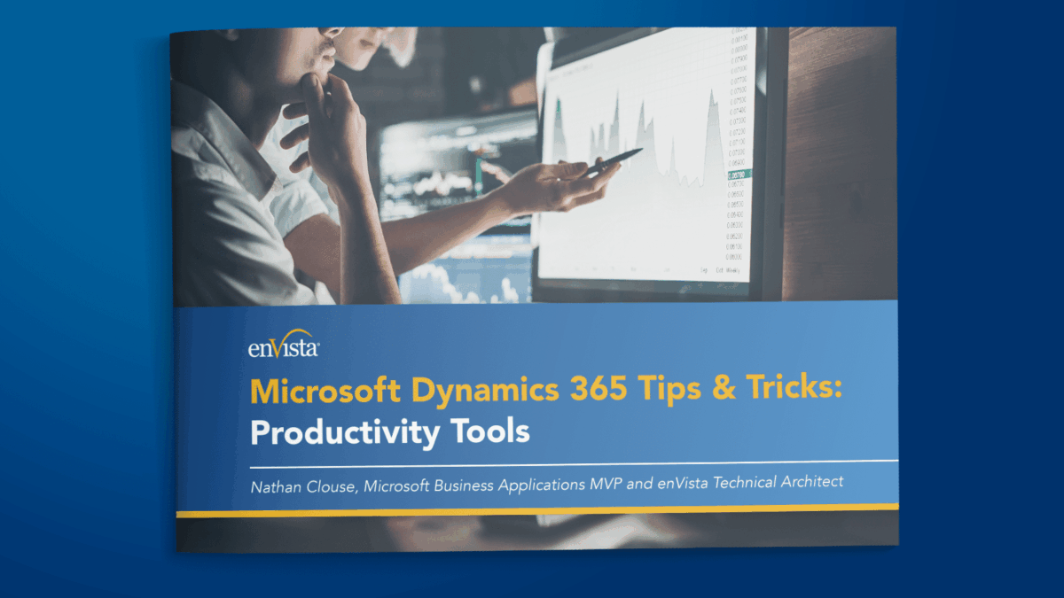 Cover of a guide titled Microsoft Dynamics 365 Tips & Tricks: Productivity Tools by Nathan Clouse, featuring two people working together, pointing at data charts on a computer screen.