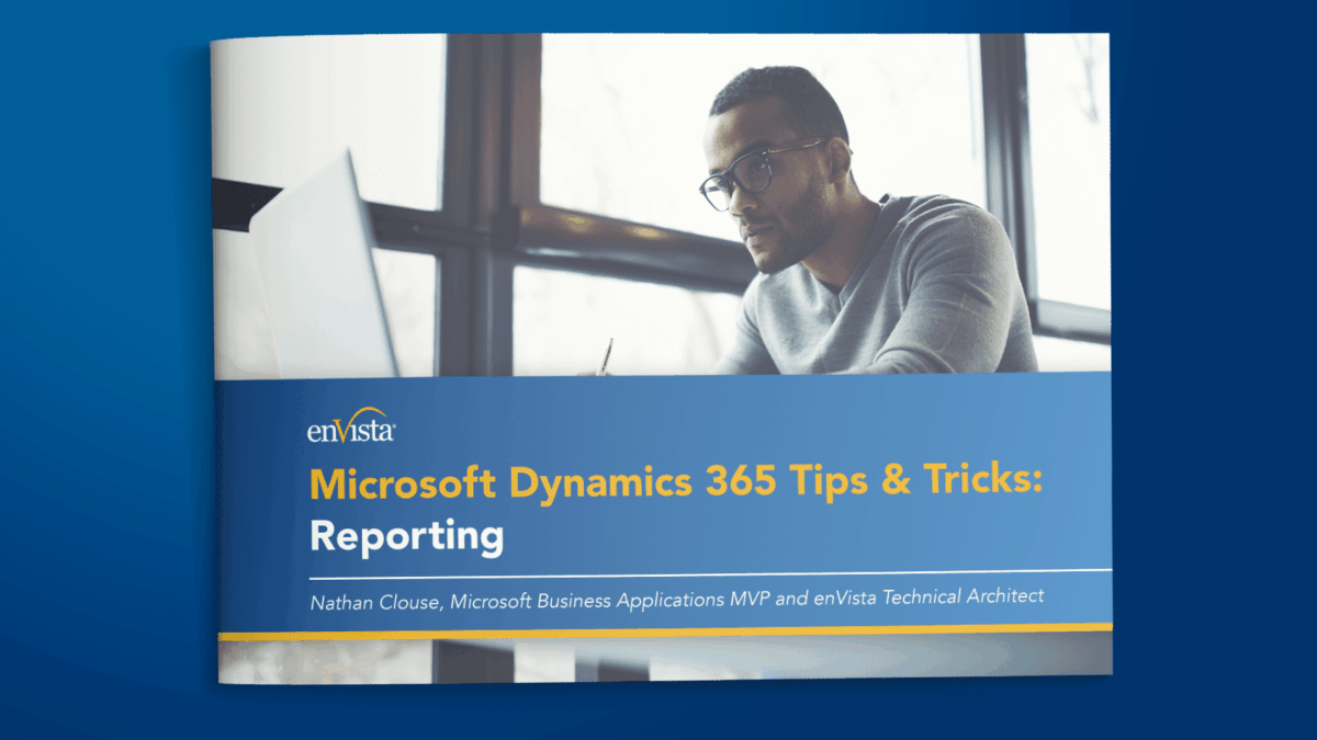 A brochure cover with a man working on a computer by a window. The title reads, Microsoft Dynamics 365 Tips & Tricks: Reporting. Subtitle: Nathan Clouse, Microsoft Business Applications MVP and enVista Technical Architect.