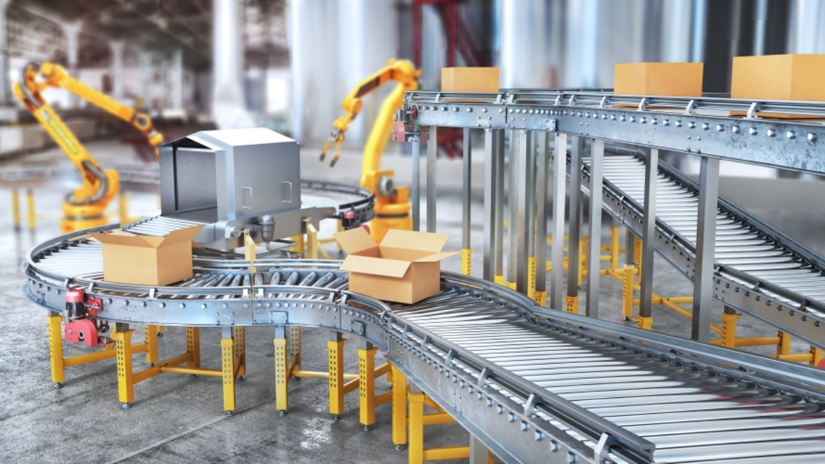 A modern factory with robotic arms and a conveyor system moving cardboard boxes, illustrating automation selection in an advanced packaging and assembly process.