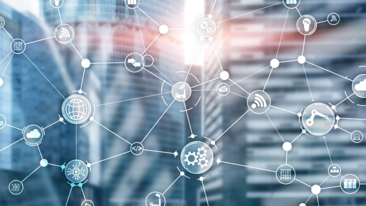 A network of interconnected digital icons representing technology, cloud computing, security, and business processes—key elements in planning strategy—overlaid on blurred modern office buildings in the background.