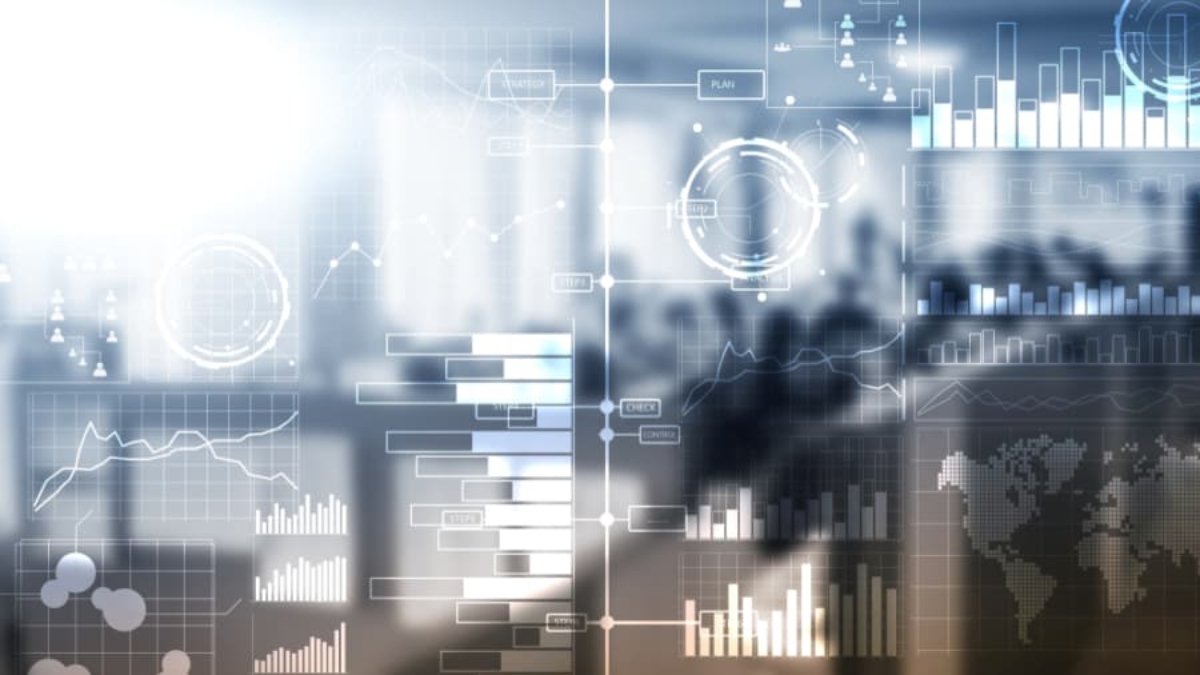 Abstract image showing transparent digital graphs, charts, and data visualizations overlaying a blurred office background with people, representing technology, Impact Analytics, data analysis, and business analytics concepts.