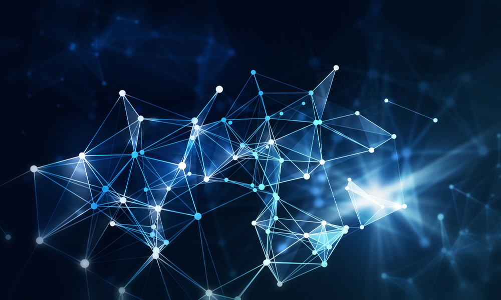 Abstract image of interconnected glowing blue and white lines and nodes forming a network or neural web, symbolizing the complexity of supply chain strategy, set against a dark blurred background with light flares.