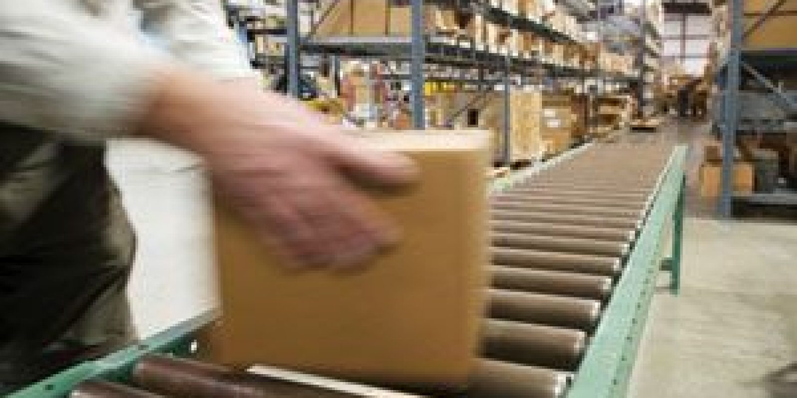 A package being placed on a conveyor belt