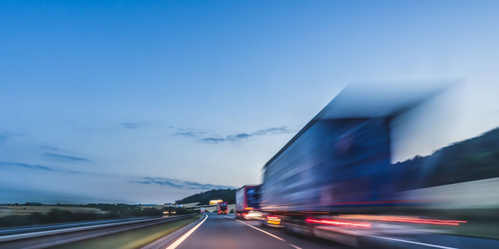 Background,Photograph,Of,A,Highway,,Trucks,On,A,Highway,,Motion